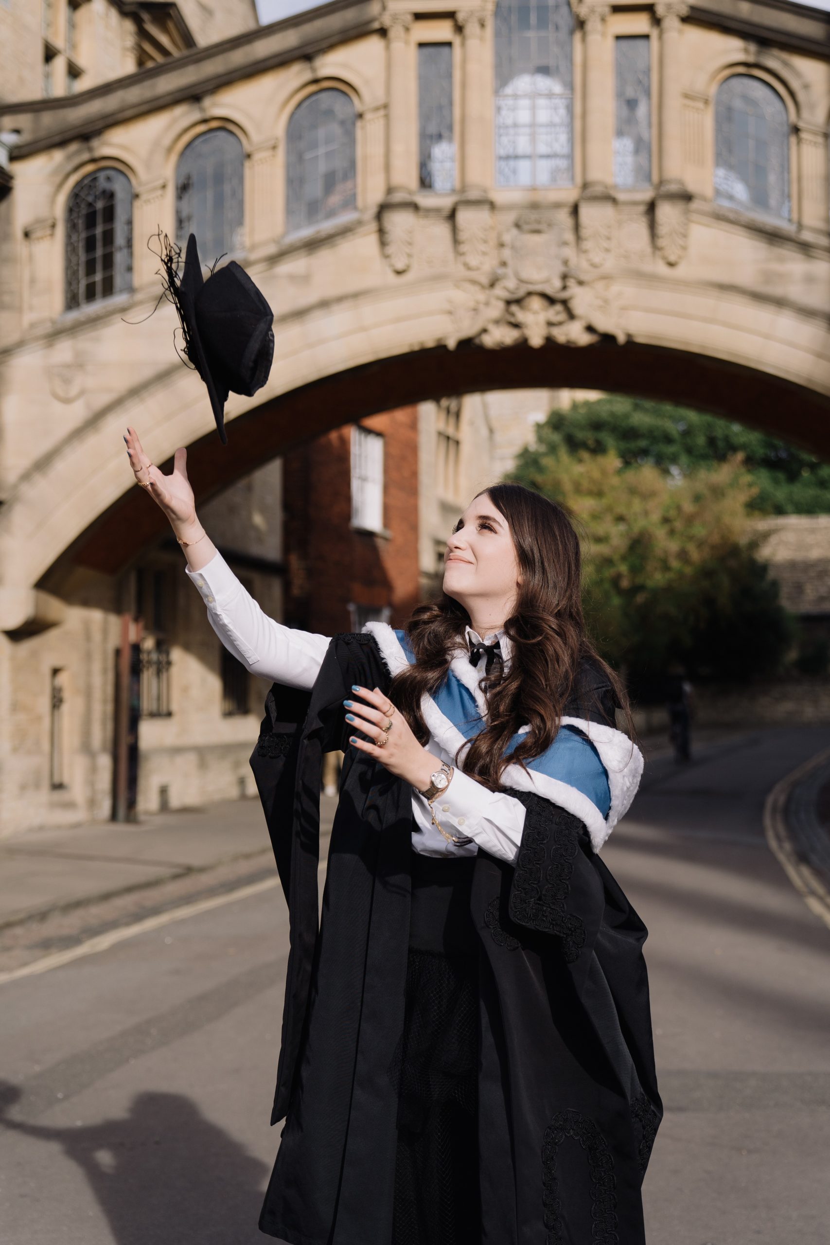 Anna throwing graduation hat